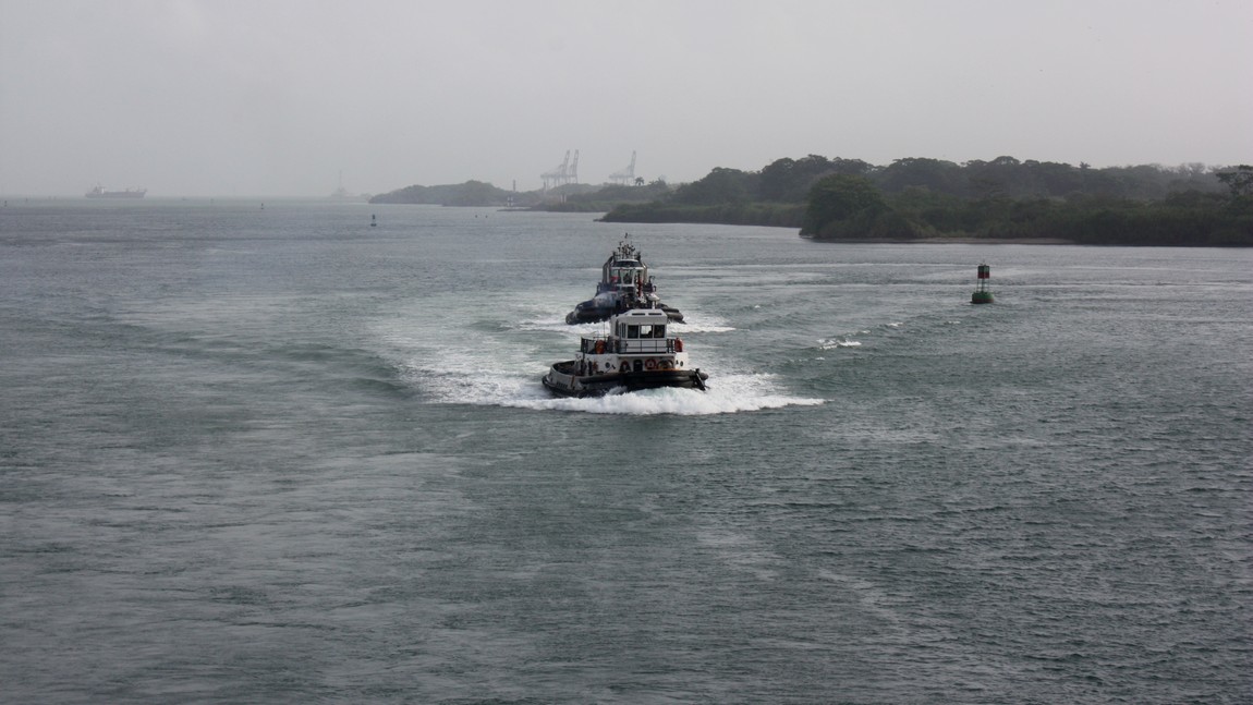 Tug boats entering Limon Bay