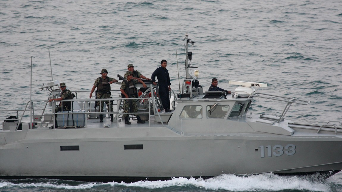A military boat passes
