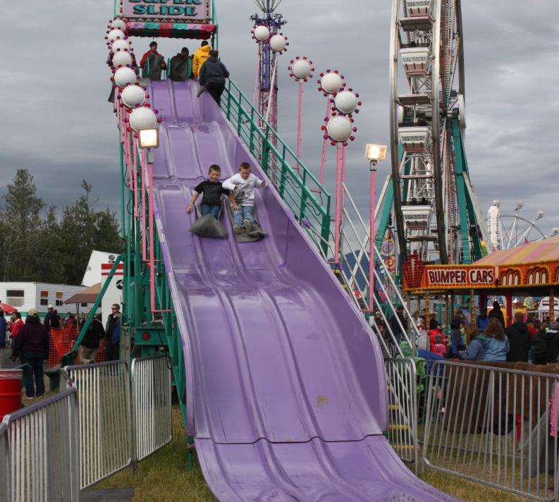 Going down the slide on a burlap sack