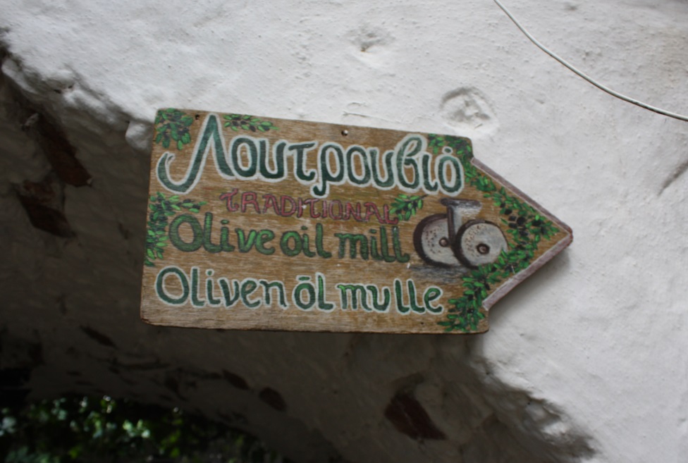 Handmade sign inviting you into the olive oil mill