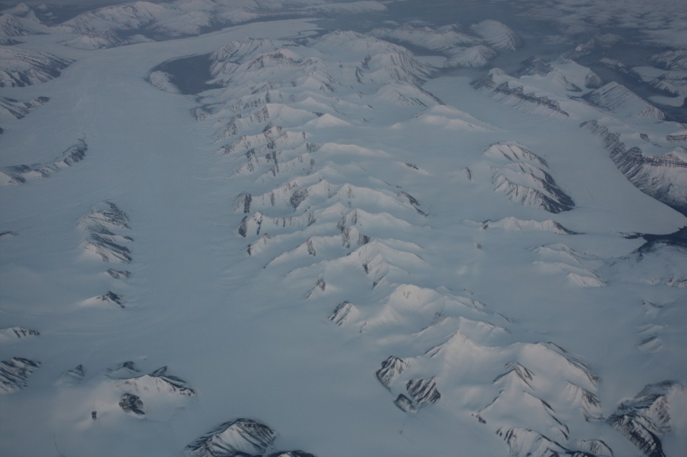 Mountain range mostly buried in ice