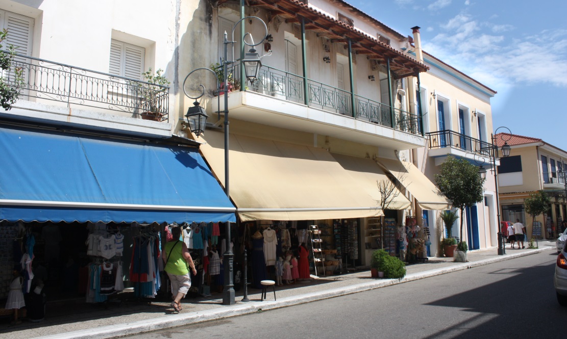 Large awnings are used to provide shade on the sidewalk