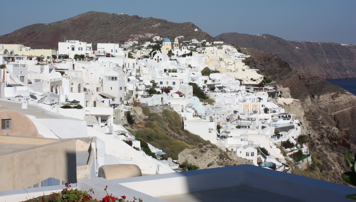 Oia with the hills of Finikia behind