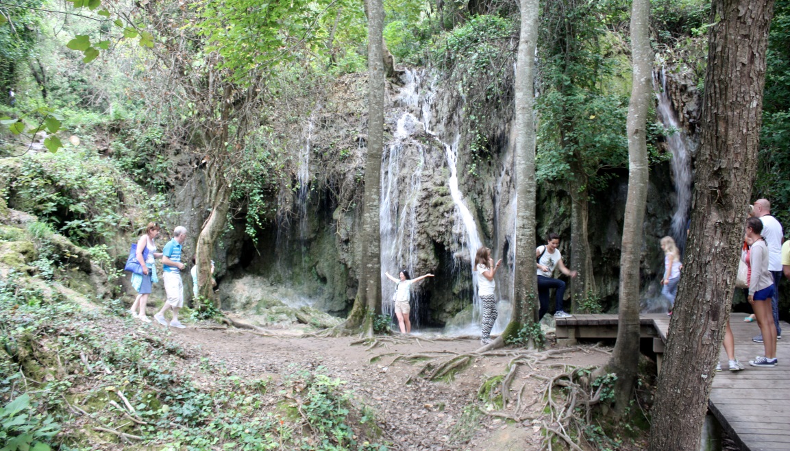 Folks having fun with small waterfalls