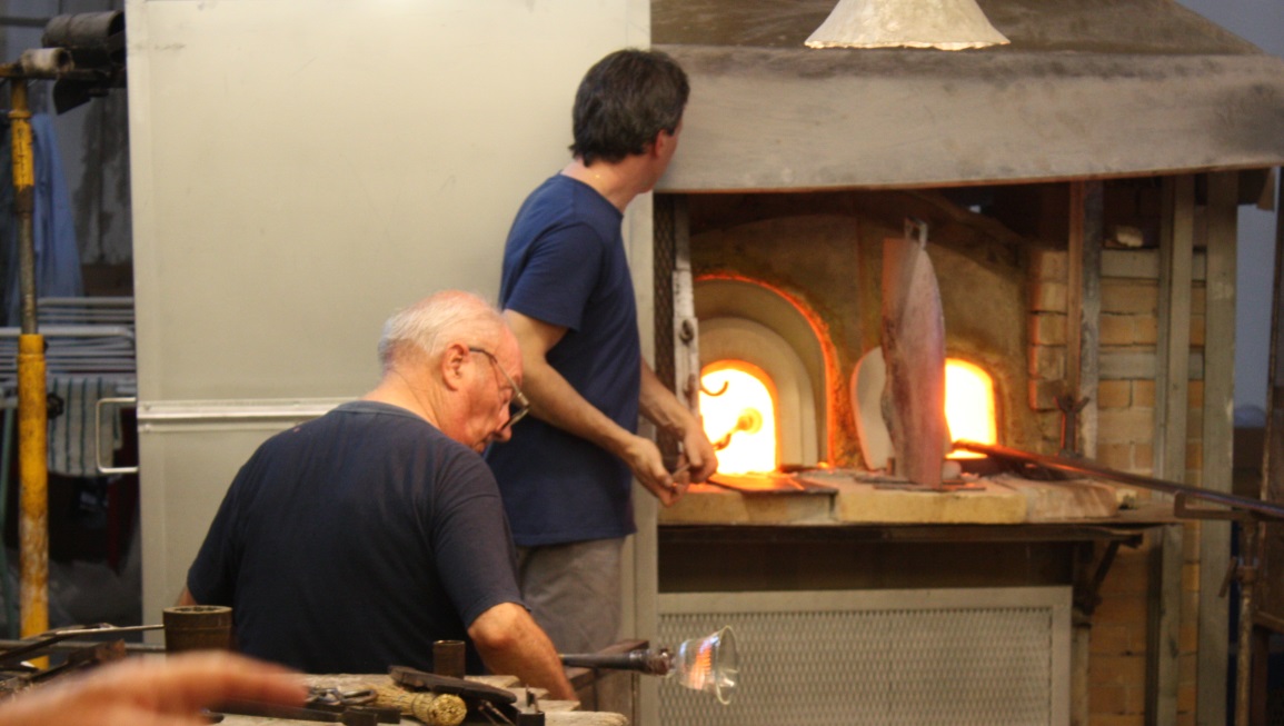 Two glass blowers at work