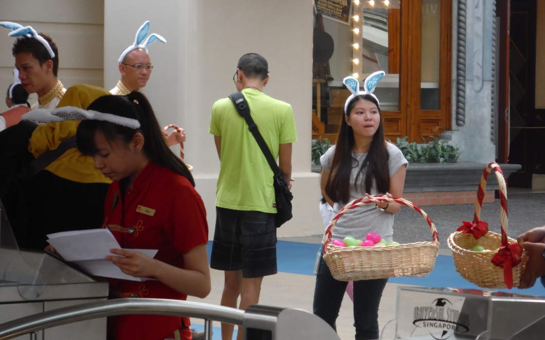 Employees are wearing bunny ears and handing out eggs