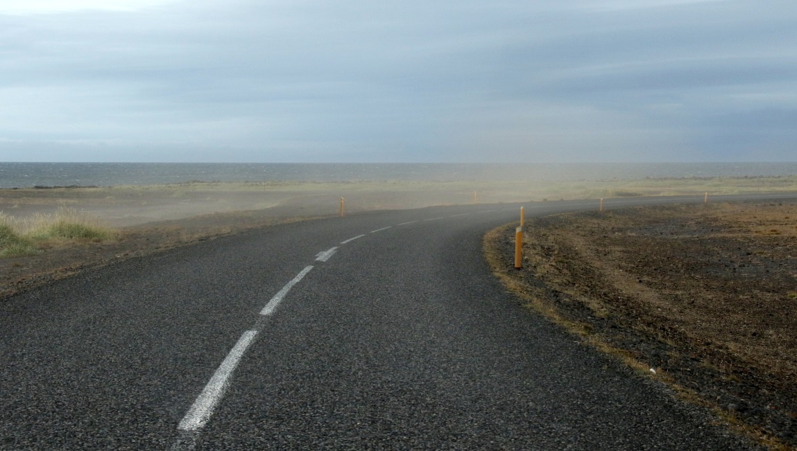 Blowing dust across the road