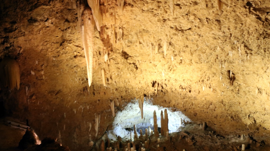 Stalactites hang from the ceiling