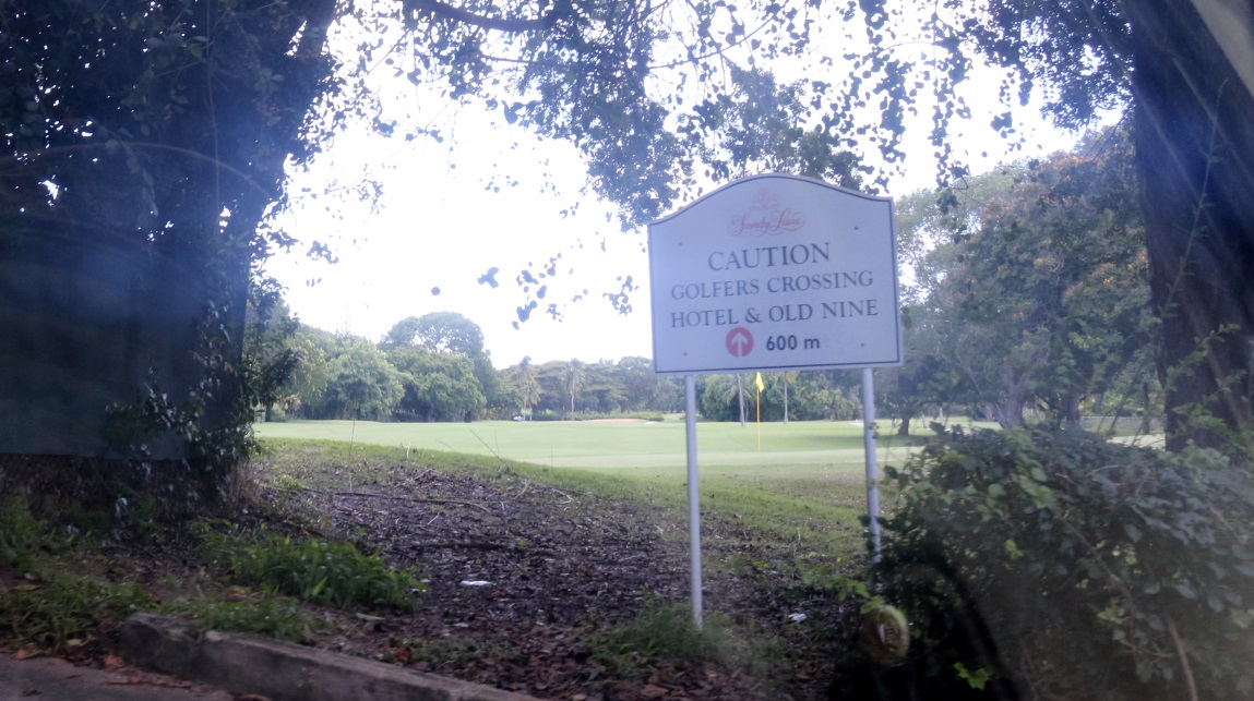 Golfers crossing sign