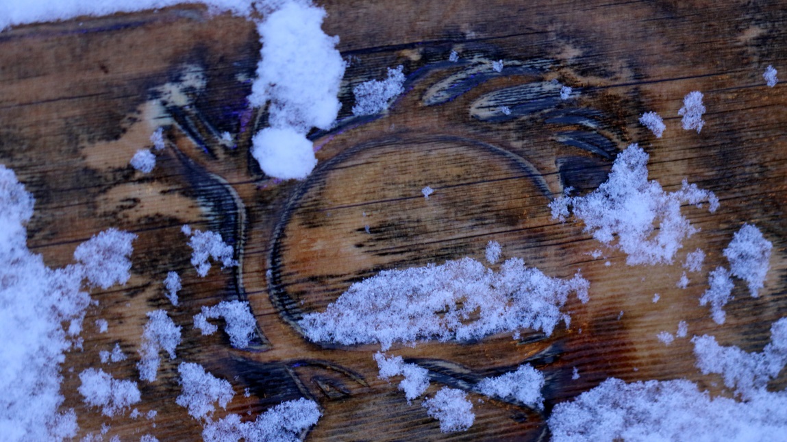 Carving in the back of a bench