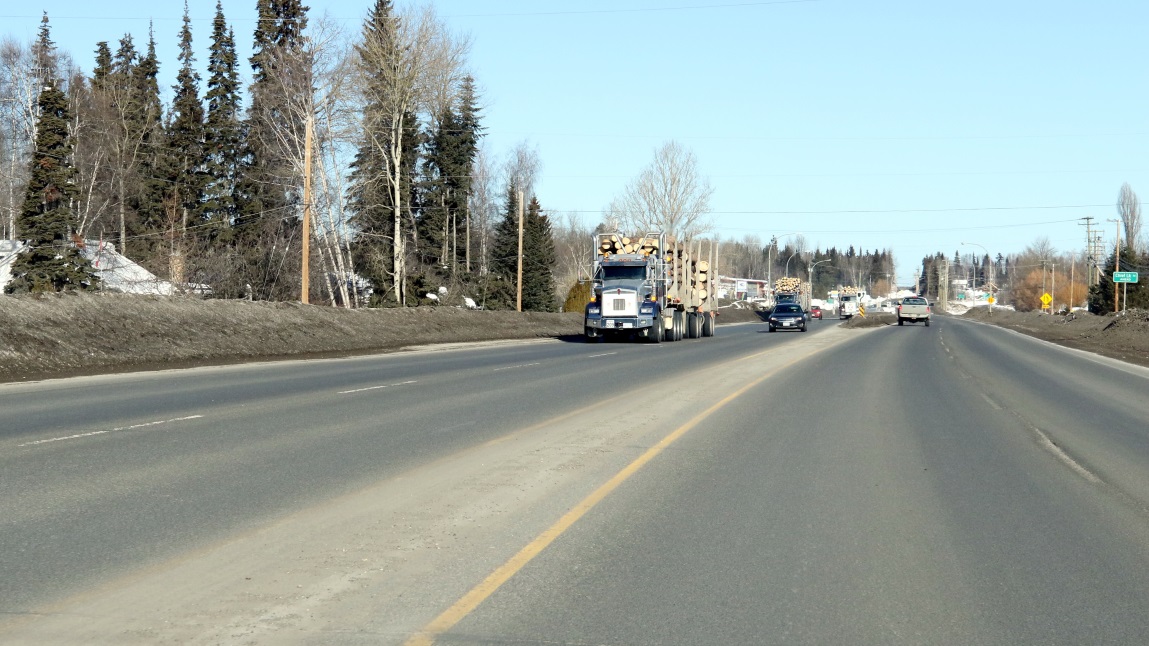 Three log trucks
