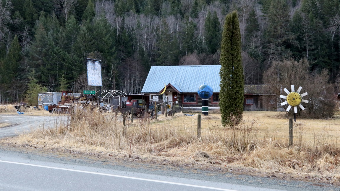 House with Sun Moon and Earth sculptures