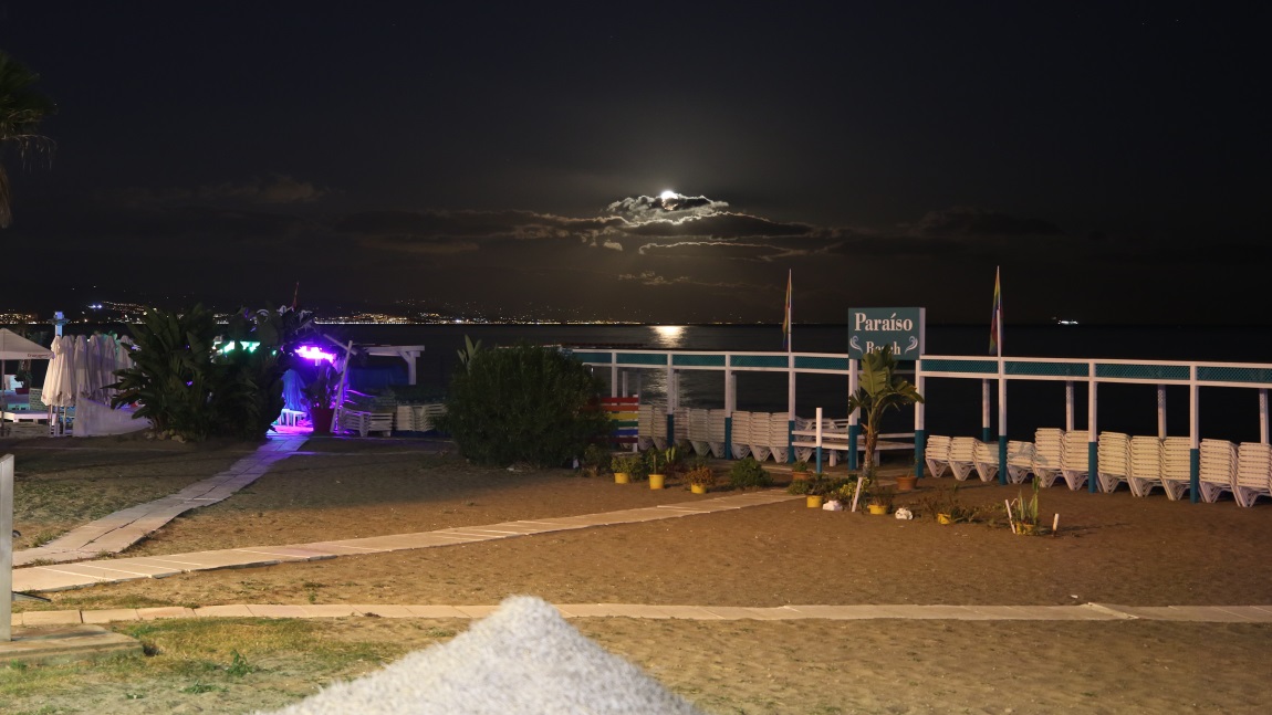 Moon rising over the beach
