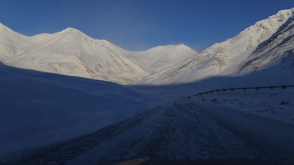 Snow blowing across the road
